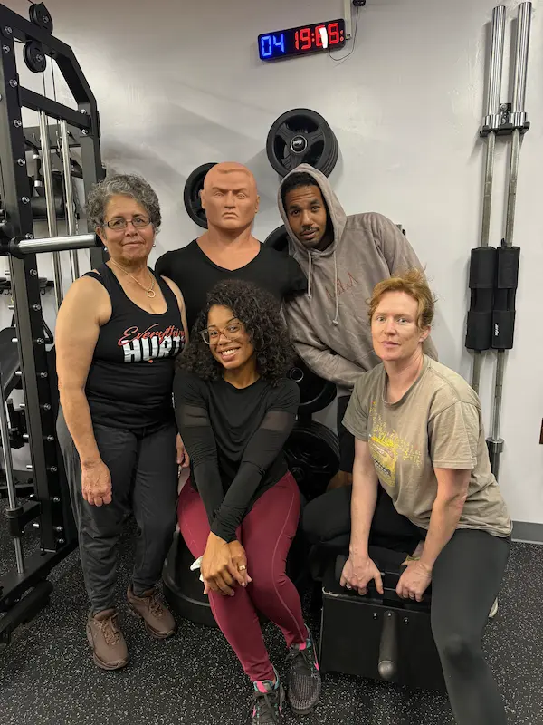 PinPoint Training members posing in the gym
